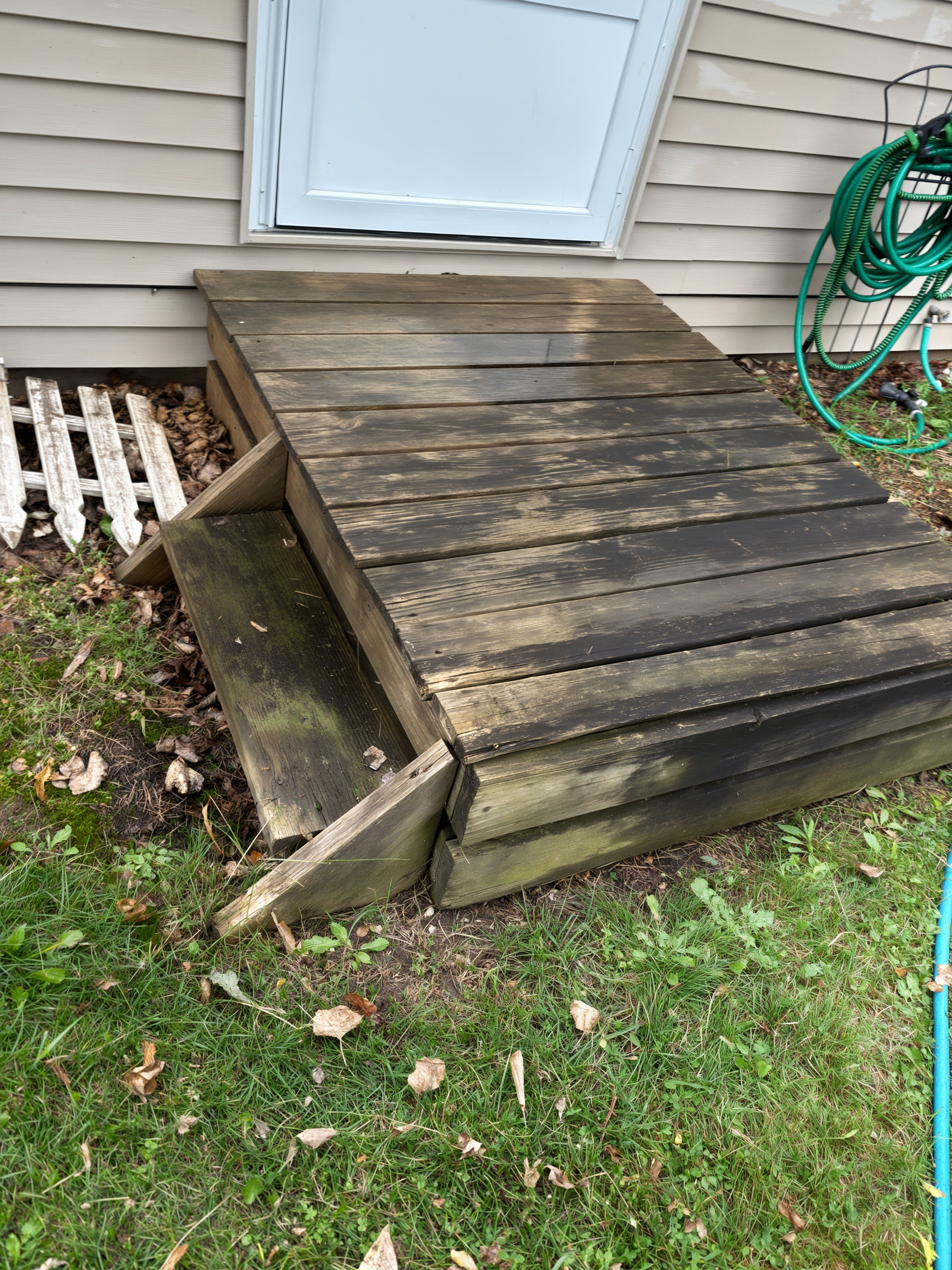 Before: deck steps covered in black mold