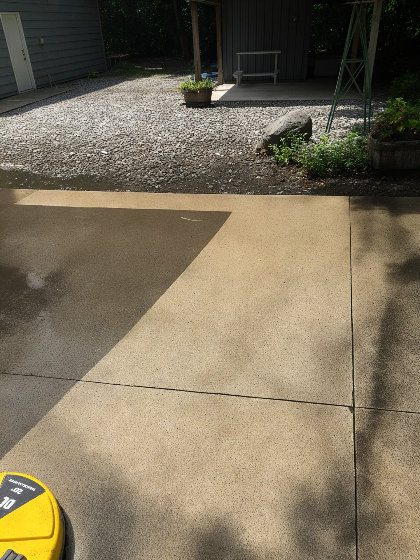 Driveway pressure washing before and after with surface cleaner clean line - Lawndash Powerwashing Mt. Pleasant Michigan